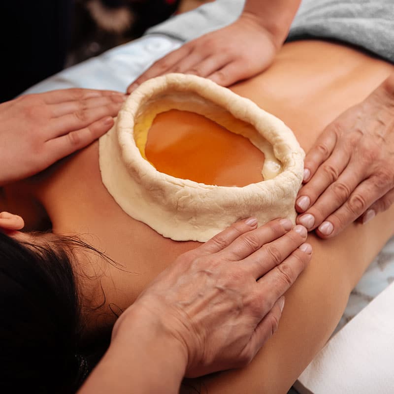 Ayurvedic dough ring for treating pain on the back.