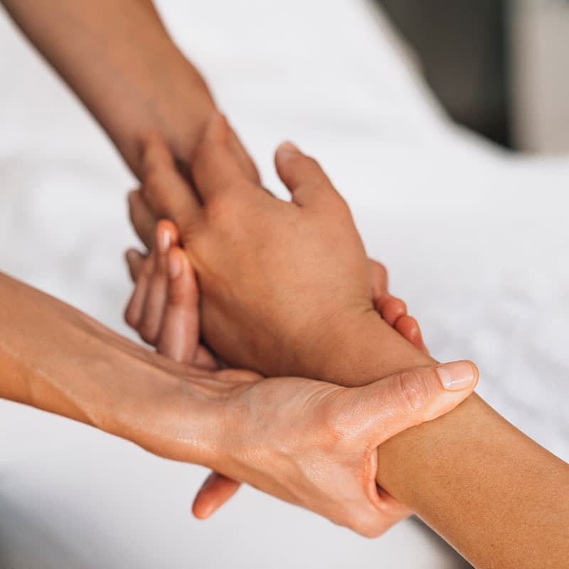 Traditional vital points massage of one hand.