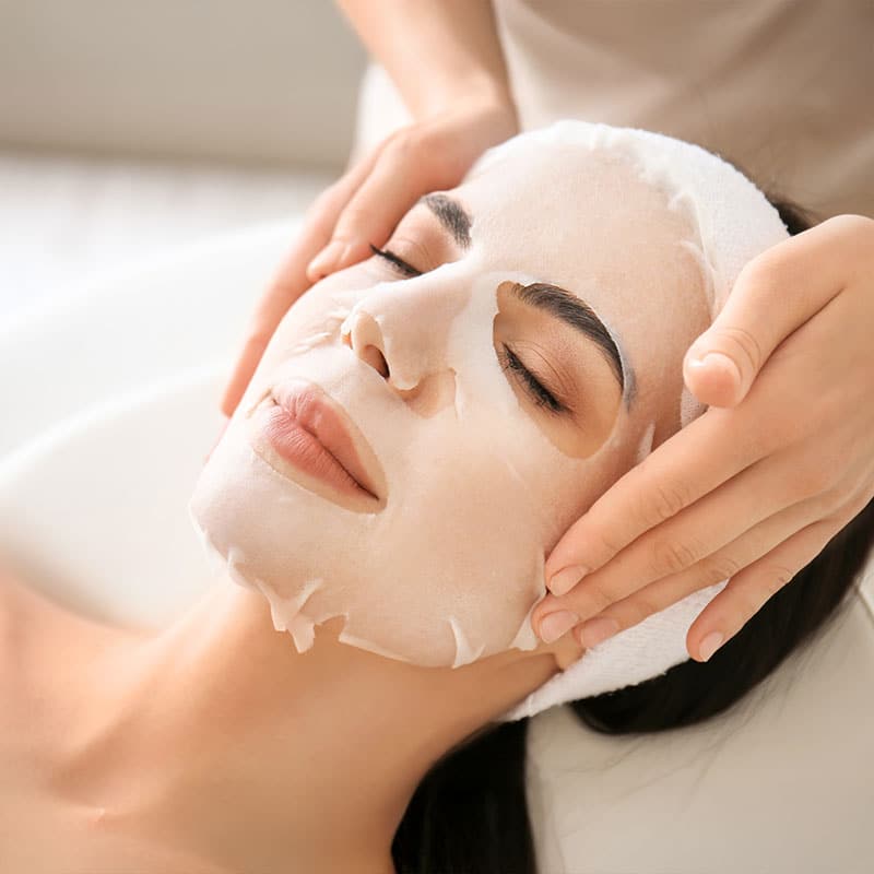 Woman receives wellness flow mask.