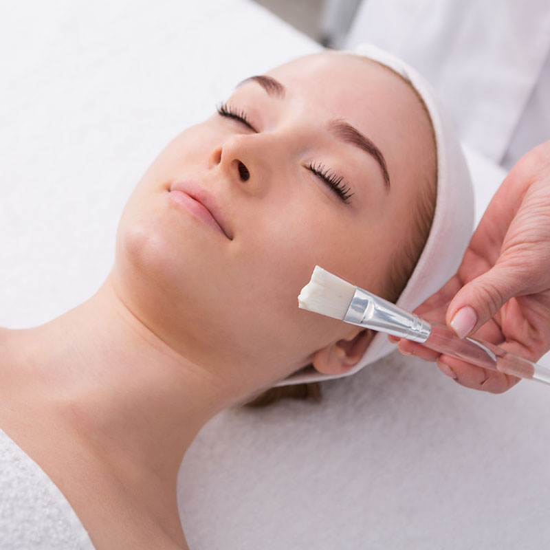 A face mask from Biodroga is applied with a brush.