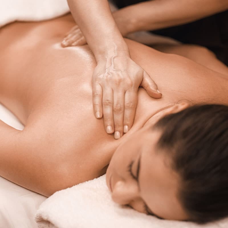 Woman relaxing with a massage on her back.