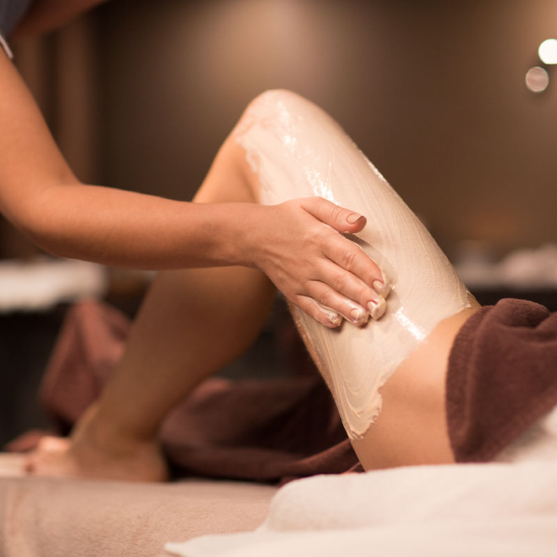 Healing chalk pack is applied to one leg for the Rasul experience.